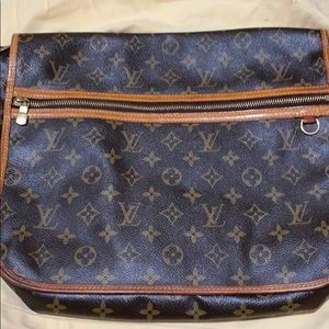 Louis Vuitton messenger bag.